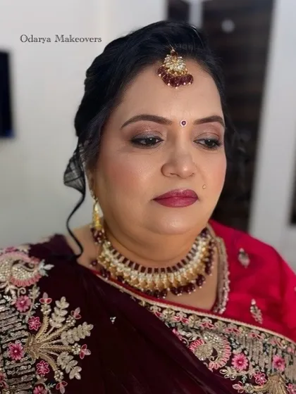 A close-up of the wedding day makeup for the bride's mother. The look is traditional, with a focus on her eyes and a beautiful bindi.