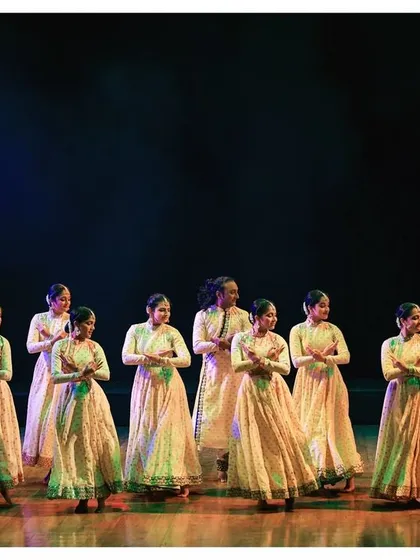 The enchanting tale of Kathak is told through every movement. This is a beautiful shot of our dancers in perfect unison, their forms creating a visual symphony on stage.