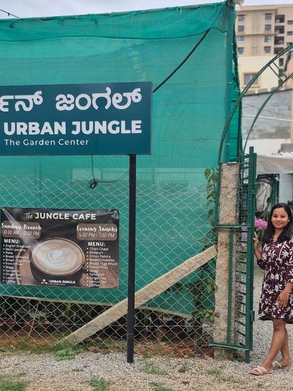 Standing by the entrance of our dream, Urban Jungle. This sign represents so much more than a name; it's a symbol of a new beginning and a community built around a love for nature.