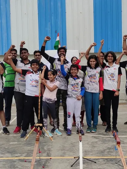The spirit of our team is our greatest strength. Here we are, arms raised in celebration, fostering a sense of unity and shared purpose that extends beyond the archery range.