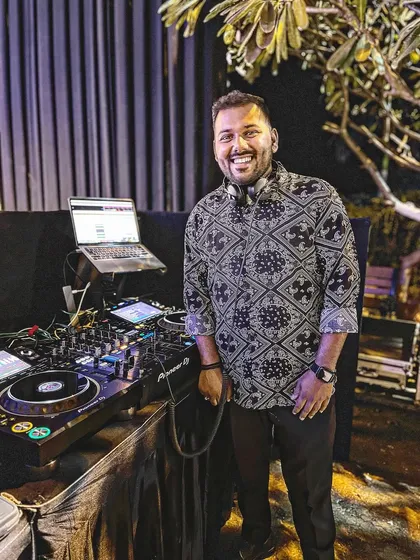 In my element at a beautiful Sangeet night in Surat. I travel for destination weddings, bringing my signature Bollywood DJ magic and professional Pioneer setup wherever the party is. A smiling crowd is my biggest reward.