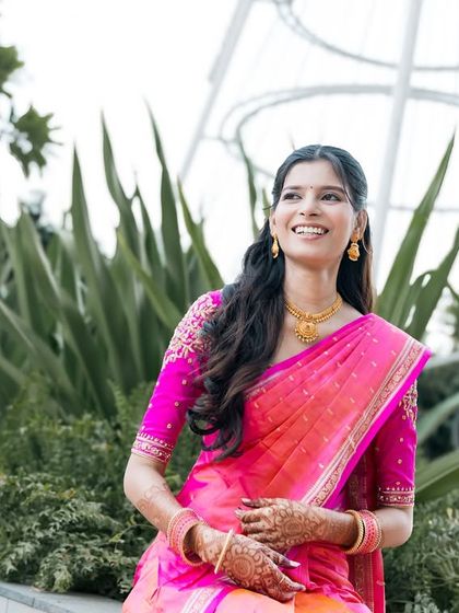 A candid shot of a bride, her face full of happiness and light.