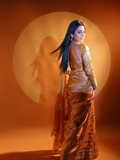 Another shot from the NDTV Marathi shoot with Isha Malviya. The backless blouse and flowing saree were complemented by sleek, straight hair and makeup that highlighted her features from every angle.