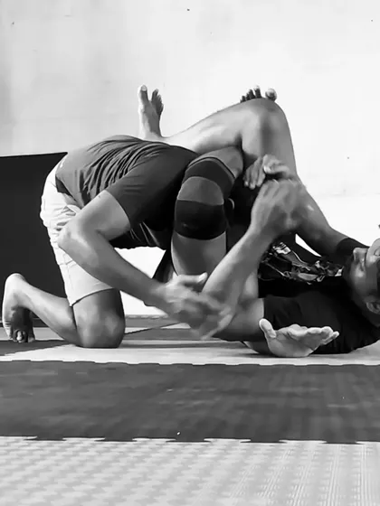 This is the intensity of No-Gi grappling. In this black and white shot, you can see the focus required during a live roll, working to pass the guard. It's a physical and mental chess match every time.