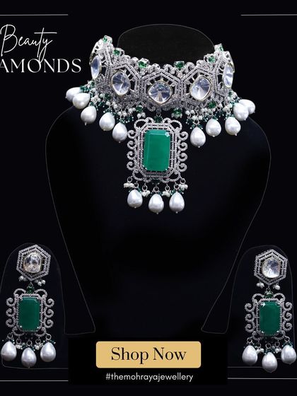 A graphic showcasing a beautiful diamond and emerald choker set. This piece is perfect for a glamorous cocktail or reception look.