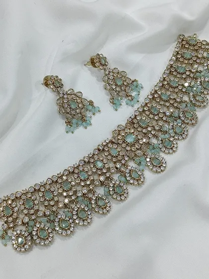 A mint green stone choker with an antique finish.