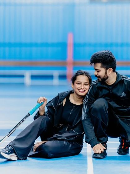 A unique pre-wedding shoot idea for a sporty couple. We captured them in their element on a badminton court, showcasing a shared hobby and their competitive yet fun dynamic.
