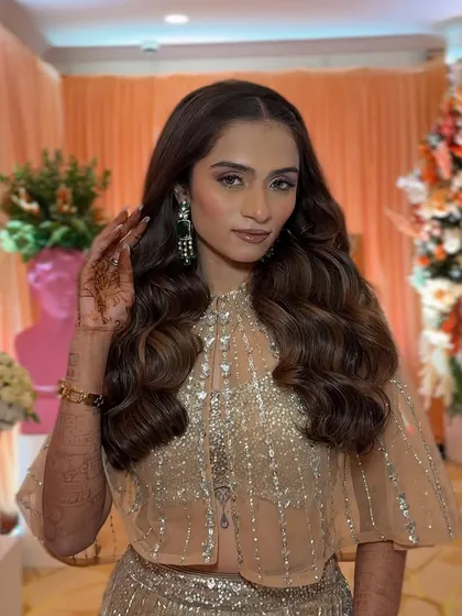 Voluminous, glamorous waves for a reception look. This style is all about making a statement and feeling like a star.