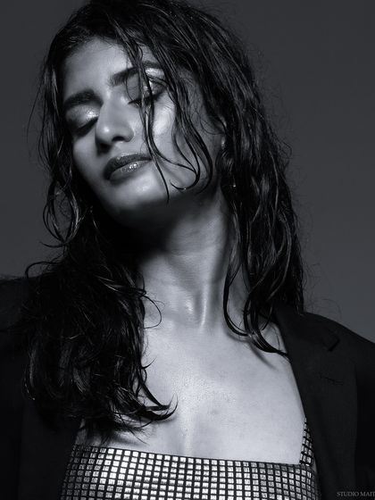 A black and white shot with eyes closed, creating a serene and artistic mood.