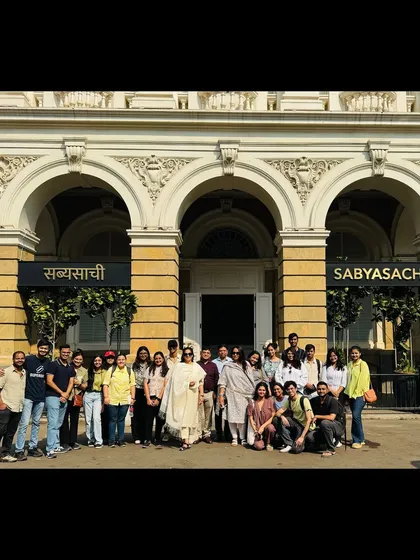 A group photo with students in front of the Sabyasachi flagship store in Mumbai, a brilliant example of adaptive reuse. These site visits provide inspiration and practical case studies for our workshop participants.