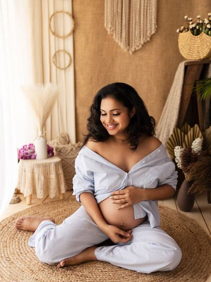 Seated on a jute rug, this pose is grounded and serene, perfectly matching the earthy vibe of the session.