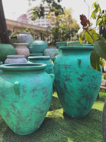 The new 'Ulu' terracotta planters have arrived. This pair shows the classic shape with a rich, distressed green finish.