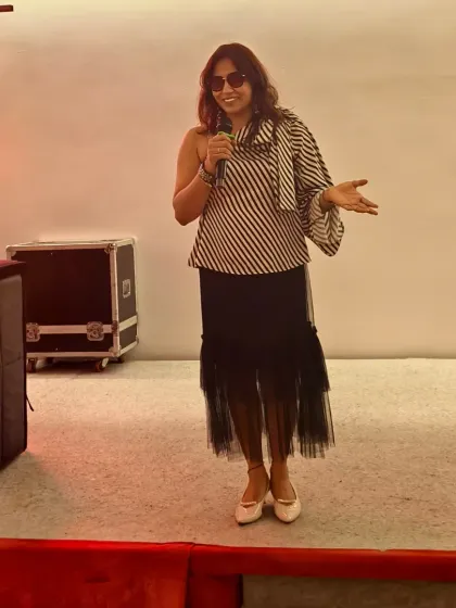A stylish shot of me on stage during the Unilever offsite. I believe in looking the part, bringing a touch of glamour and professionalism to every corporate event.