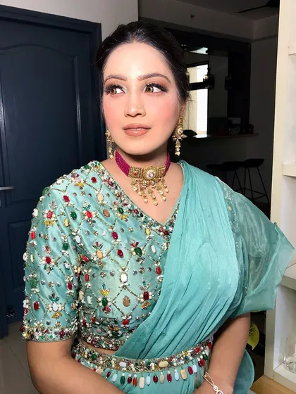 Another angle, showing the ruffled details of her saree.