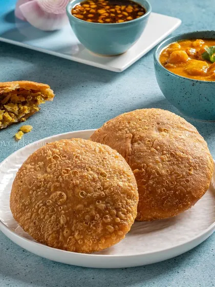 Crispy Kachoris from Gulab Sweets, served with a side of potato curry.