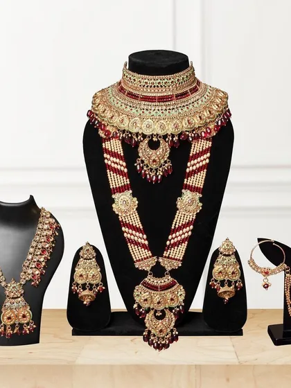A complete bridal jewelry collection displayed on various stands. This group shot is perfect for showcasing the full range of a collection for e-commerce.