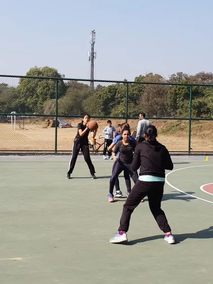 Mastering the fundamentals is crucial. This photo shows our female players practicing their triple threat stance, a foundational position that gives them the option to shoot, pass, or dribble effectively.