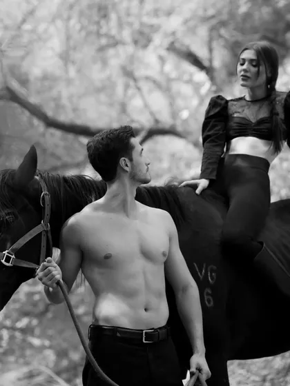 The dynamic between the models and the horse creates a compelling narrative in this professional photograph taken at our location.