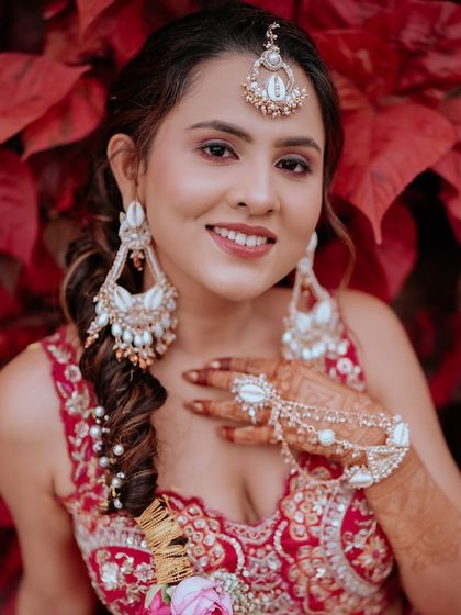 A close up of Sayeri's Haldi look. The shell jewellery and soft makeup create a beautiful and unique bridal look.
