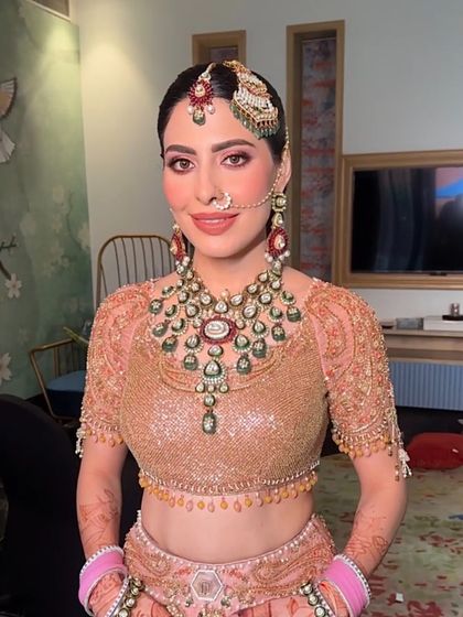 The bride looking radiant, her hair and makeup perfectly done for her special day.