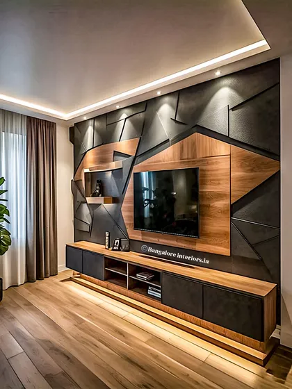 I designed this full-wall TV unit to be a statement piece. It features a mix of wood and geometric dark panels, with integrated backlighting to create a dramatic and modern focal point in the living room.