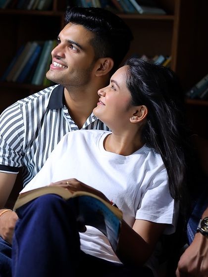 The library set provides a warm and intimate atmosphere for this couple's pre-wedding photoshoot.