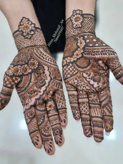 A full-coverage Indian mehendi design with intricate details. The pattern uses a mix of floral, paisley, and geometric elements.