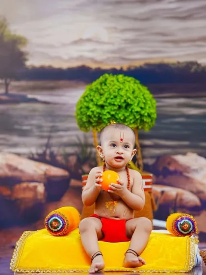 A moment of discovery as the baby holds a piece of fruit from the offering basket.