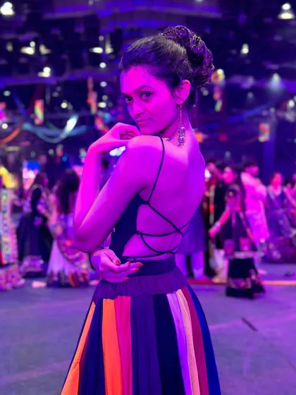 A pose showing off the back details of my Navratri outfit and my braided bun hairstyle. Getting the complete look right is part of the main character energy for Garba nights.