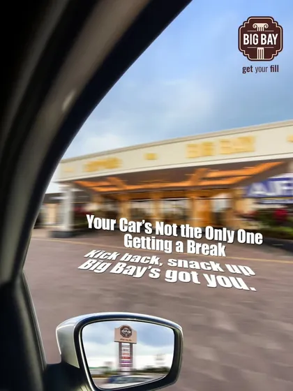 A creative shot from inside a car, with the reflection of our sign in the side mirror. It reminds you that it's not just your car that needs a break, you do too.