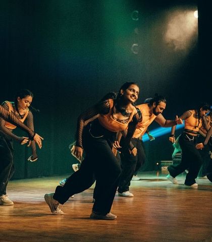 The dancers move with power and grace, telling a story of strength through their synchronized Afro choreography.