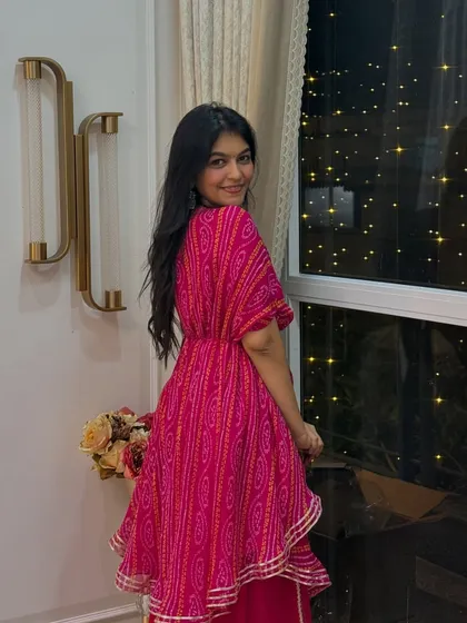 Another look at my Diwali sharara set. The asymmetrical top and belted waist add a modern twist to the traditional bandhani print.
