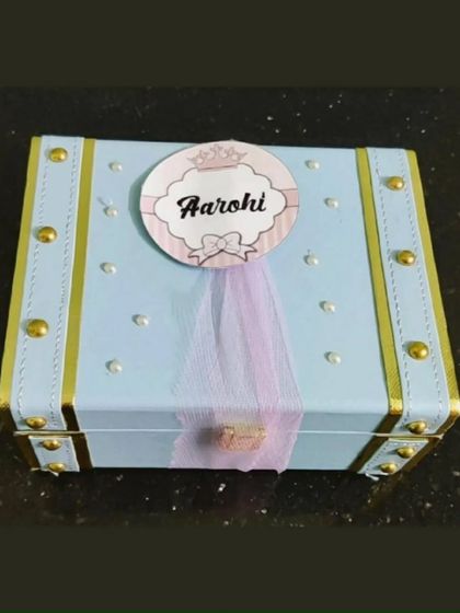 A personalized trunk for a sister named Aarohi. The custom name tag with a little crown adds a royal touch to this thoughtful gift.