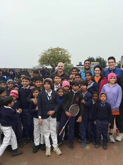 An impromptu stop at a village school during our Delhi-Agra ride. The local children were as curious about our guests as they were about them, leading to this wonderful group photo.