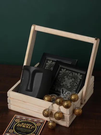 A duplicate of ID 127, this modern hamper features a unique face-planter mug, premium chocolates, and decorative lights in a rustic wooden basket.