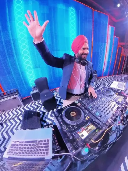 A happy wave from my DJ console. This is my magic station where the party comes to life.
