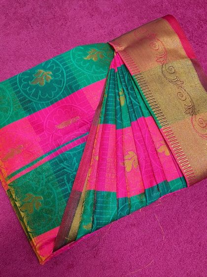 The final result of my packing service. This bright pink and green saree is perfectly folded and ready for the client.