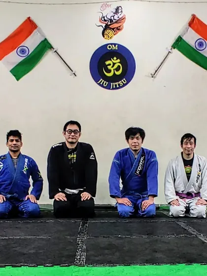 Respect and brotherhood on the mats. Posing with fellow Jiu-Jitsu practitioners after a tough but rewarding training session. The bonds we build here are as strong as the techniques we learn.