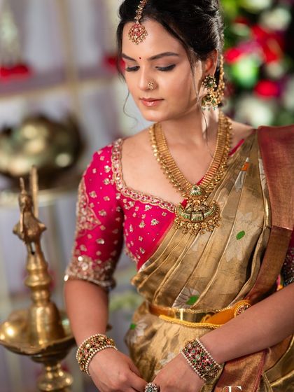A close-up on the details. The makeup highlights her eyes, and the skin has a beautiful, natural glow that pairs perfectly with the traditional gold jewellery.