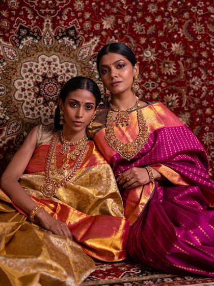Two of our bridal looks featured side-by-side. The golden-pink tissue silk and the deep pink Kanchipuram silk both represent the pinnacle of bridal luxury.