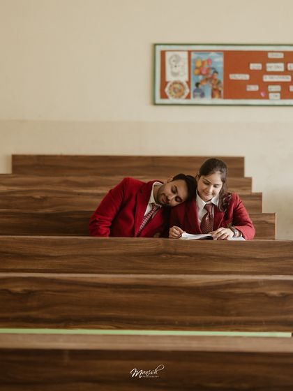 A sweet, quiet moment of rest on a classroom bench, symbolizing the comfort and support they've always found in each other.