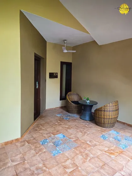 This cozy, private sit-out area is attached to one of our rooms. It's the perfect spot for a quiet morning coffee or a conversation, surrounded by the calm ambiance of the resort.