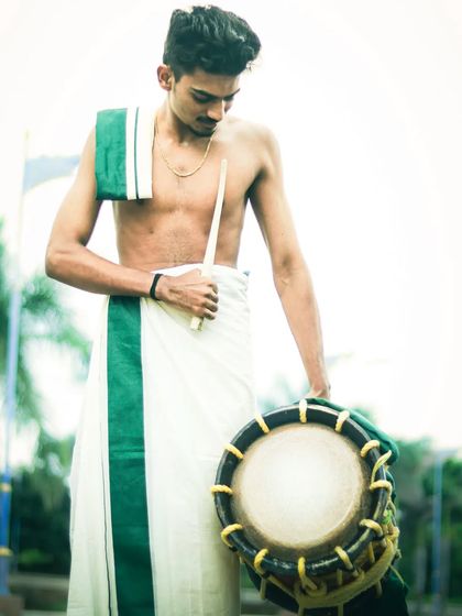 A moment of quiet connection with the instrument. Before the explosive sound, there is respect for the Chenda.