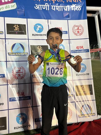 A young champion loaded with medals after a successful Day 3 at TrackNights.