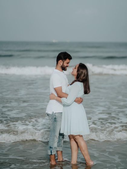 A romantic embrace in the gentle waves of the sea. This kind of shot captures the intimacy and connection between a couple.