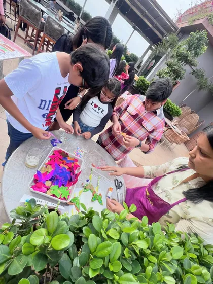 I'm helping a group of kids with a paper craft activity at an outdoor party. I love bringing creative projects to events and seeing the kids get excited about making things.