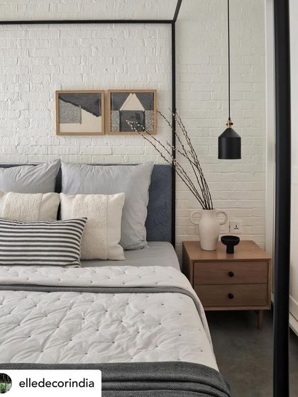 This image from our Elle Decor feature shows a daughter's bedroom with a four-poster bed against a white brick wall. The design is a perfect blend of her love for white with a touch of rustic charm.