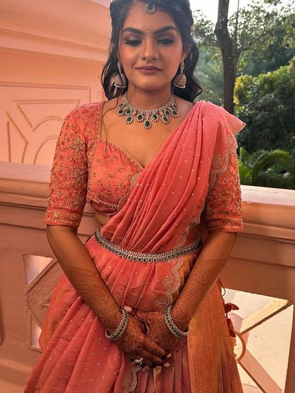 The complete look of the peach langa davani with a matching waist belt. Every detail is designed to create a cohesive and elegant outfit.