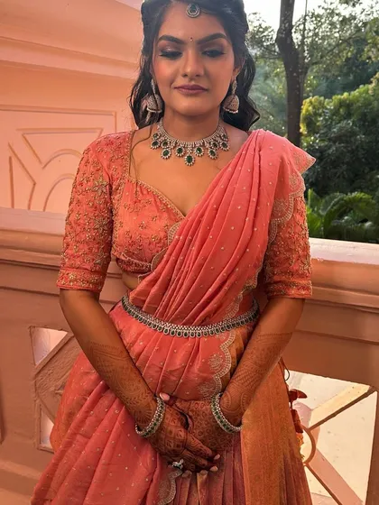 The complete look of the peach langa davani with a matching waist belt. Every detail is designed to create a cohesive and elegant outfit.
