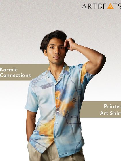 The Karmic Connections printed art shirt for men. The design features a blend of soft blues and warm yellows, representing the beautiful, unexpected intersections in life. It’s a story you can wear.